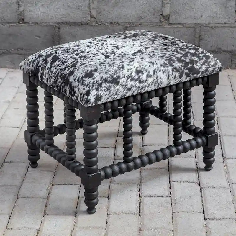 Petit banc en imitation peau de vache, base en acajou noir mat